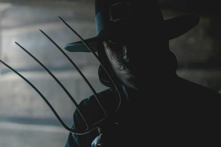 A masked killer holds a pitchfork in "Thanksgiving."