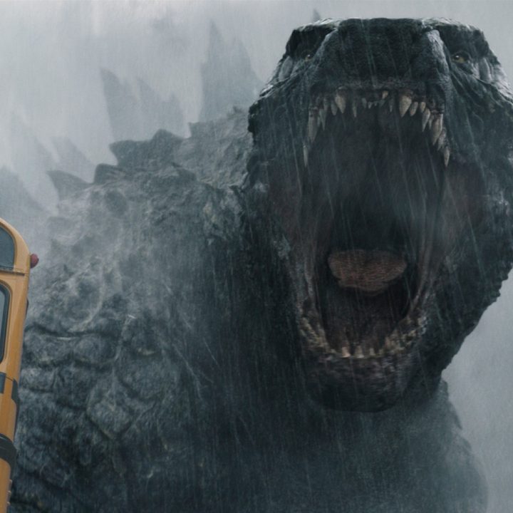 Godzilla roars at a school bus.