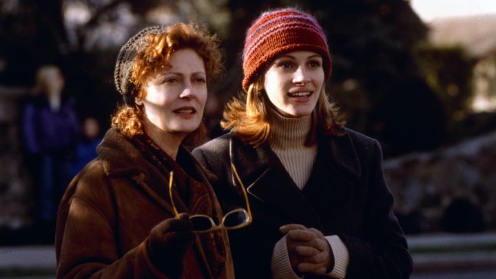 Susan Sarandon and Julia Roberts as Jackie and Isabel standing next to each other and looking ahead in the film Stepmom.