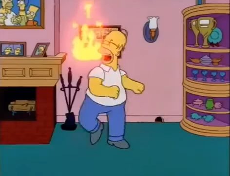 Homer dancing in front of a fire in "The Simpsons."