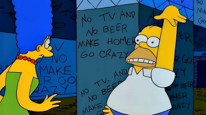 Homer and Marge in a haunted house in "The Simpsons."