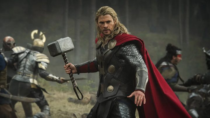 Chris Hemsworth's Thor poses with his hammer.