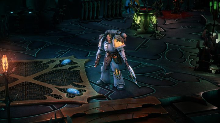 A space marine standing in a ship.