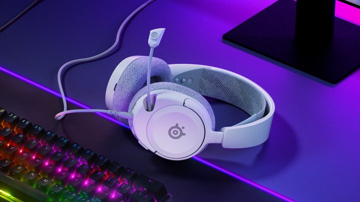 Steelseries Arctis Nova 1 sitting in front of a gaming keyboard.