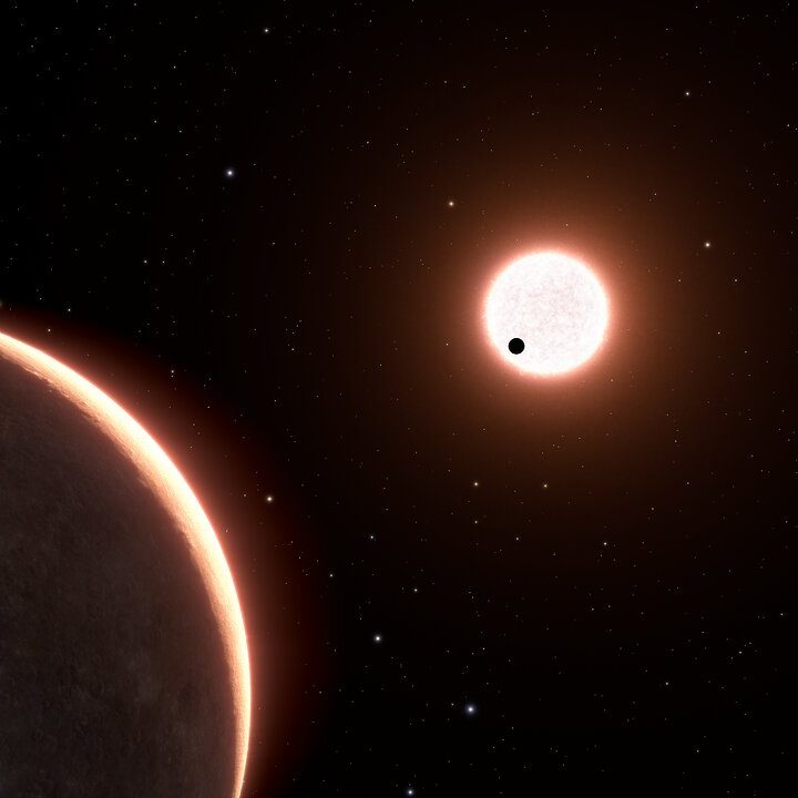 This is an artist’s concept of the nearby exoplanet, LTT 1445Ac, which is the size of Earth. The planet orbits a red dwarf star. The star is in a triple system, with two closely orbiting red dwarfs seen at upper right. The black dot in front of the foreground star is planet LTT 1445Ab, transiting the face of the star. Exoplanet LTT 1445Ac has a surface temperature of roughly 500 degrees Fahrenheit. The view is from 22 light-years away, looking back toward our Sun, which is the bright dot at lower right. Some of the background stars are part of the constellation Boötes.