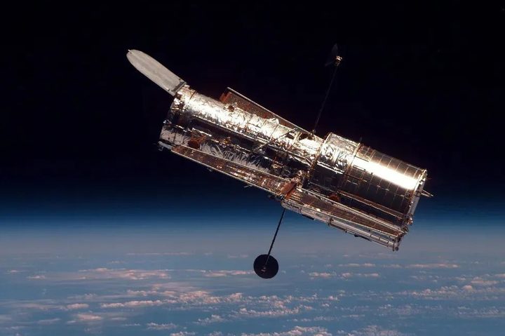 The Hubble Space Telescope orbits Earth.