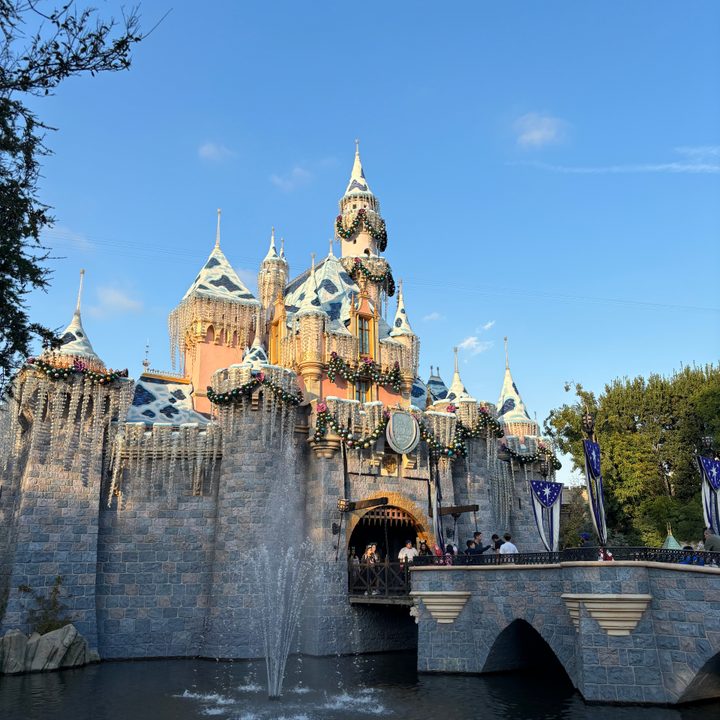 Sleeping Beauty Castle at Disneyland decorated for the holidays taken with iPhone 15.