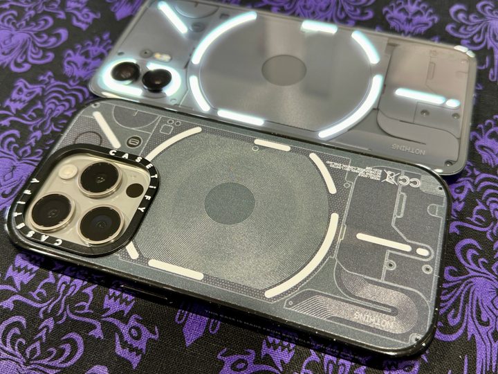iPhone 15 Pro in Casetify Nothing Case and a Nothing Phone 2.