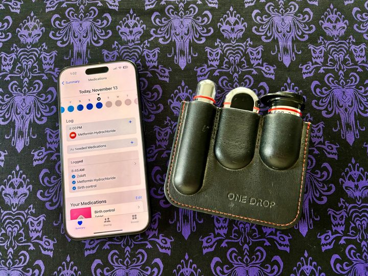 iPhone 15 Pro showing Medications in Health app along with One Drop diabetic kit.