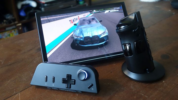 A Legion Go sits on a table with its controllers dethatched.