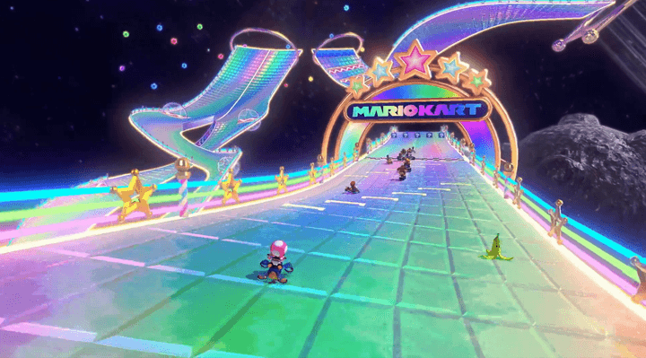 Toadette rides on Rainbow Road in Mario Kart 8 Deluxe.