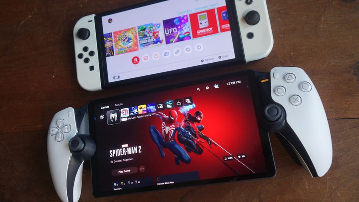 A PlayStation Portal sits next to a Nintendo Switch OLED.