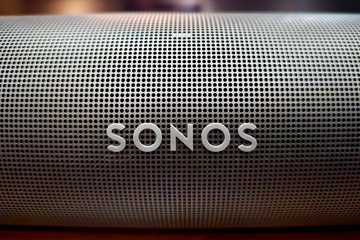 Close up of Sonos logo on a Sonos Arc soundbar.