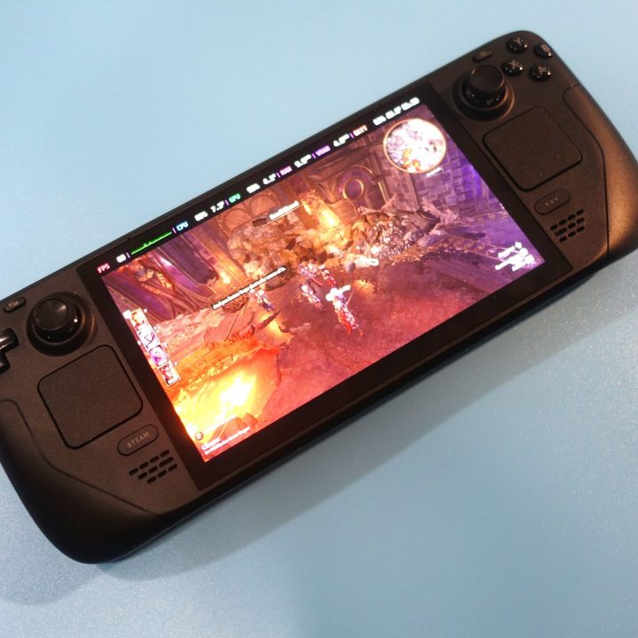 A Steam Deck OLED sits on a table.