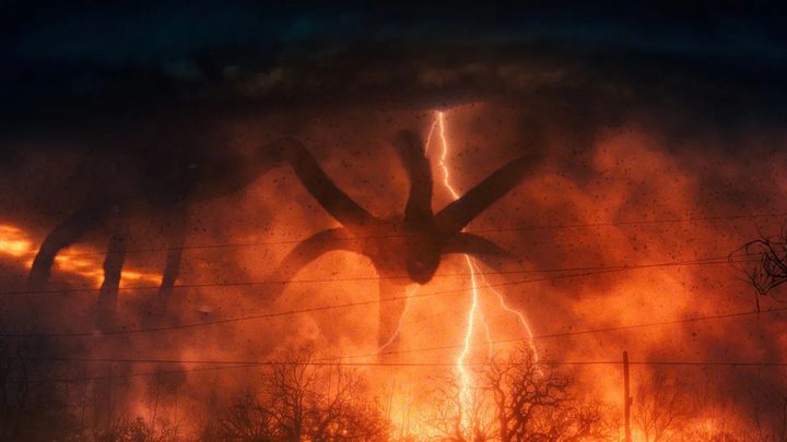 The Mind Flayer in Stranger Things surrounded by fire and darkness from the Upside Down.