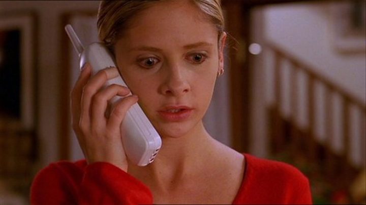 Buffy speaks to paramedics on the phone, shocked, in The Body