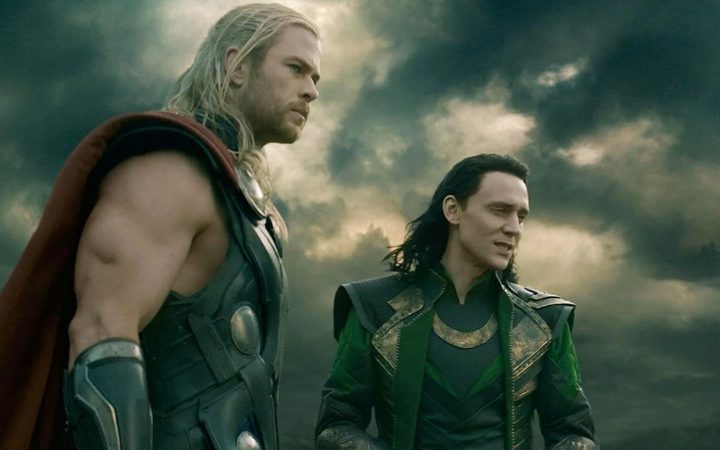 Thor and Loki look at something in Thor: The Dark World.