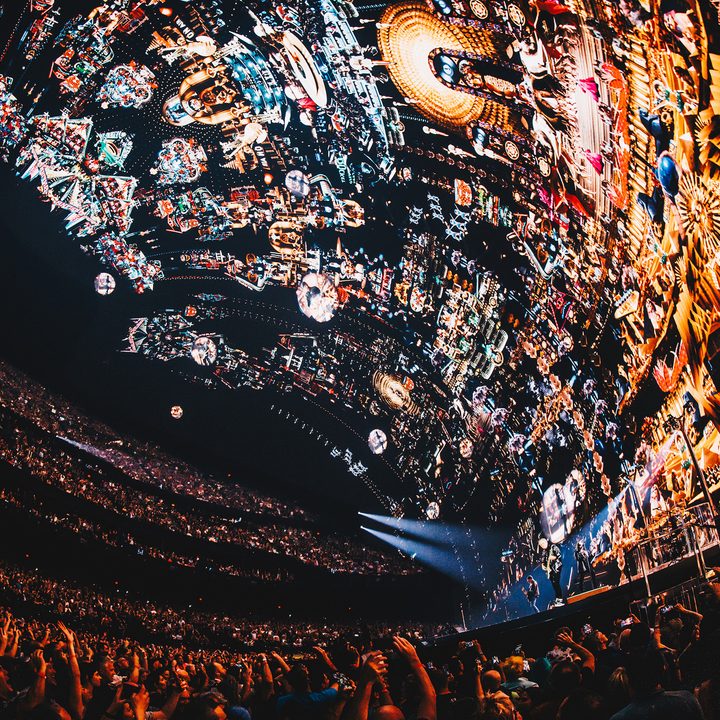 A wide-angle image inside the Sphere in Las Vegas showing how the visualization crawls up the sides and top of the venue.