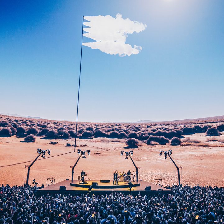 The U2 concert at the Sphere in Las Vegas, with audience members holding cell phones in their hands.