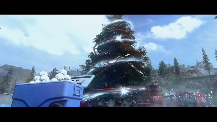 A christmas tree with a box of snowballs.