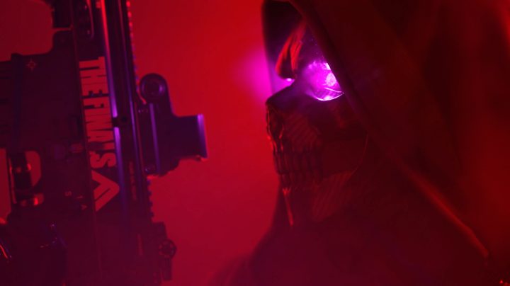 A man in a skull mask with glowing eyes.