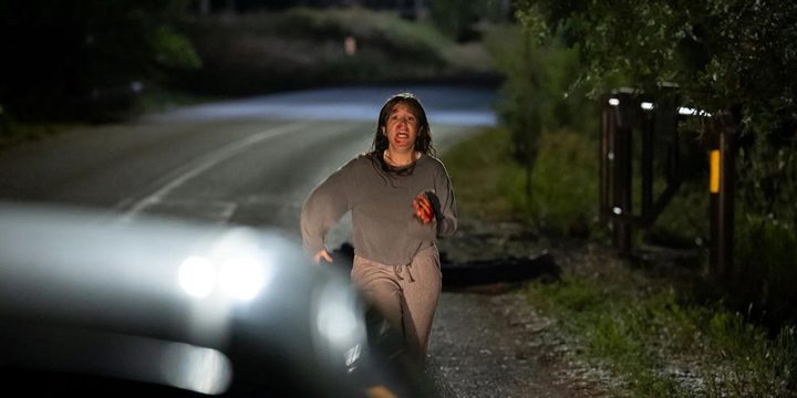 A girl runs to a car in Sick