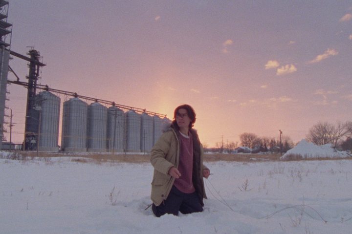Forrest Goodluck kneels in the snow in How to Blow Up a Pipeline.
