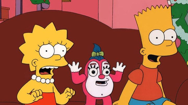Lisa and Bart with an evil toy.