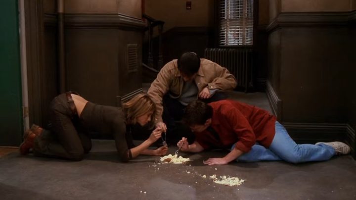 Rachel, Joey, and Chandler eating a pie from the floor in Friends.