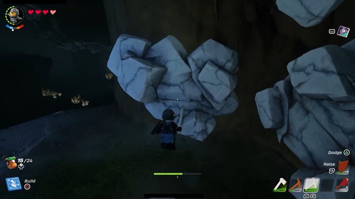 A lego guy about to mine some marble.