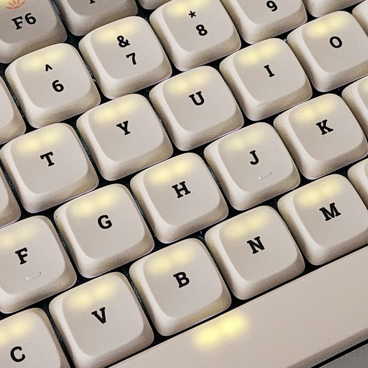 Backlight bleeding through white retro dye-sub PBT keycaps on Lofree Flow low-profile mechanical keyboard.