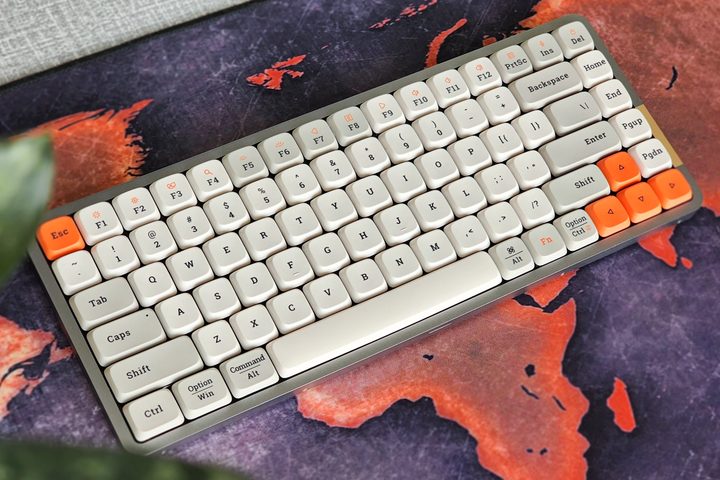 Lofree Flow low profile mechanical keyboard with Kailh switches and white retro styles dye-sub pbt keycaps on a desk.
