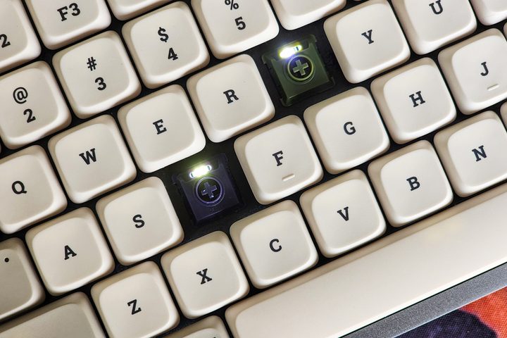 Lofree Flow low profile mechanical keyboard with Kailh tactile Phantom and linear Ghost switches and white retro styles dye-sub pbt keycaps on a desk.
