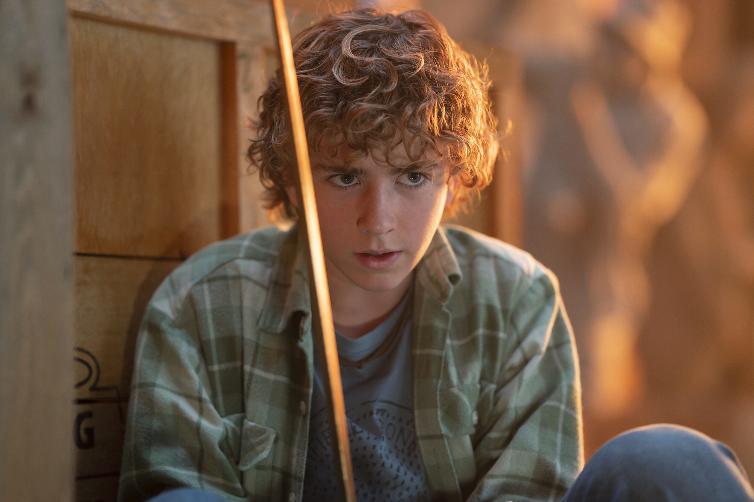 Percy Jackson holds Riptide in Percy Jackson and the Olympians.