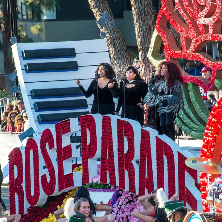 A group of singers on a Rose Parade float.