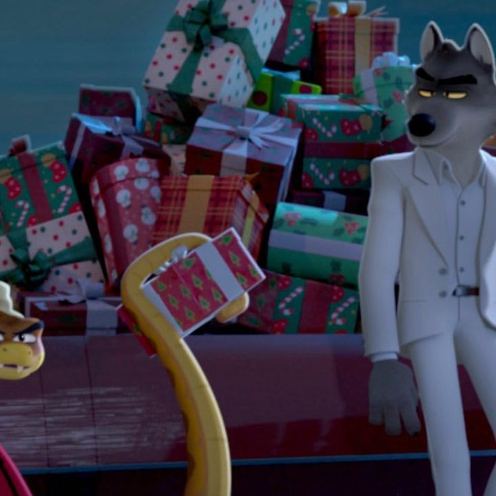 A snake holds a present while sitting next to a wolf in front of a sleigh.
