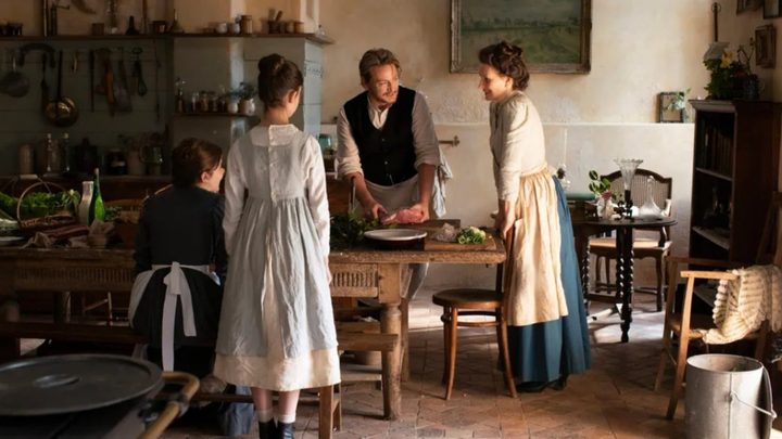 Four people cook a meal in The Taste of Things.