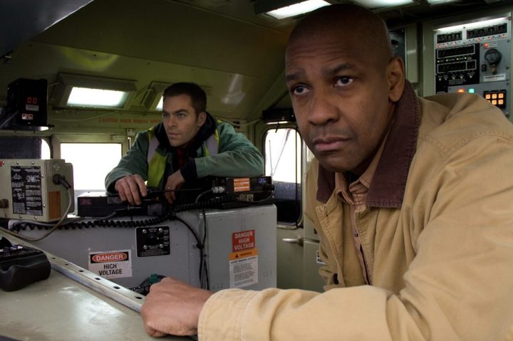 Two conductors operate a train.