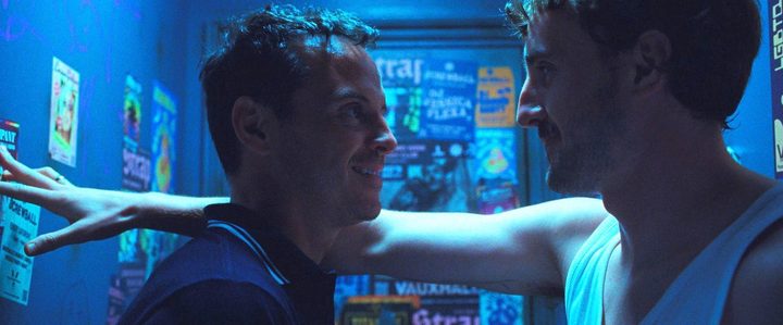 A man talks to another man in All of Us Strangers.