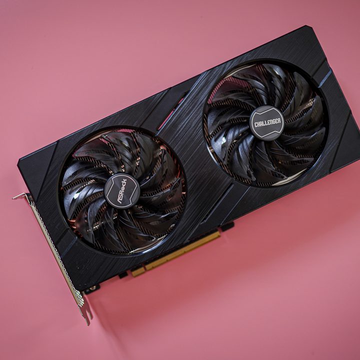 Intel Arc A580 graphics card on a pink background.