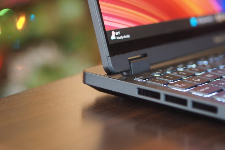 Asus ProArt Studiobook 16 OLED side rear view showing hinge and vents.