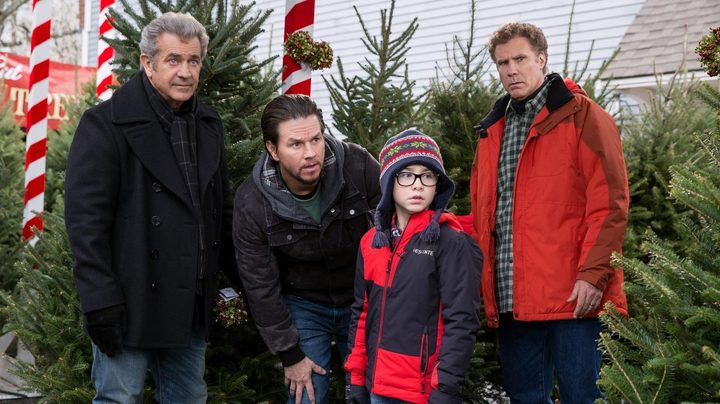 Three adult men stand around a kid in Daddy's Home 2.