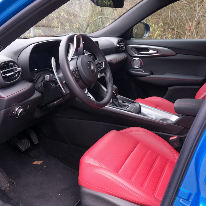 The front seats and foot wells of a Dodge Hornet R/T.