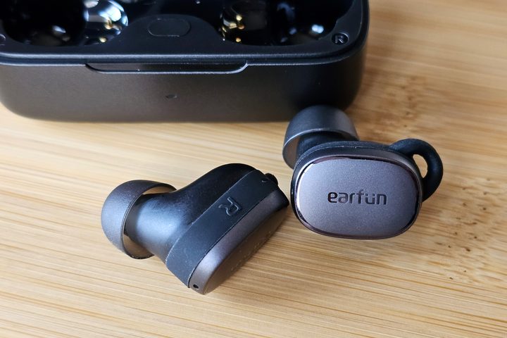 EarFun Free Pro 3 beside charging case.