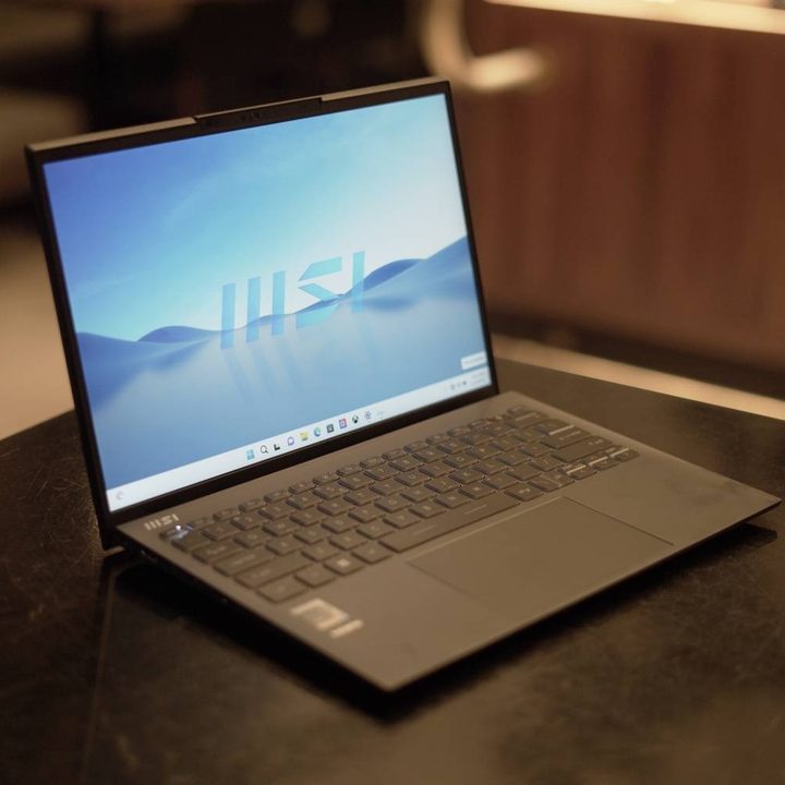 The MSI Prestige 13 open on a table.