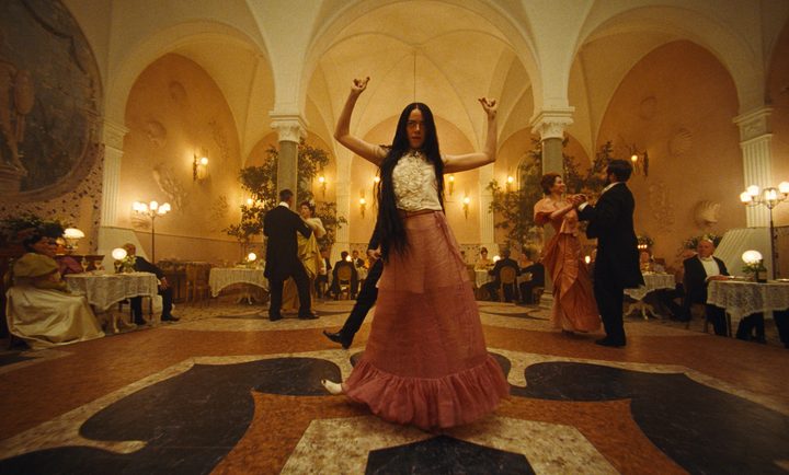 A woman danced in a ballroom in Poor Things.