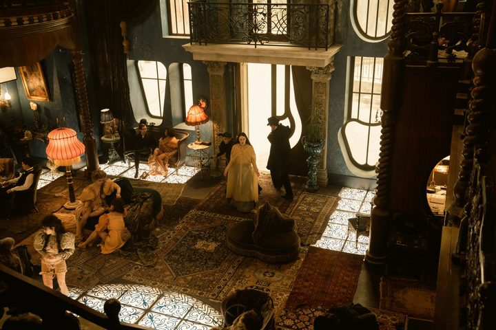 Women cluster in a house in Poor Things.