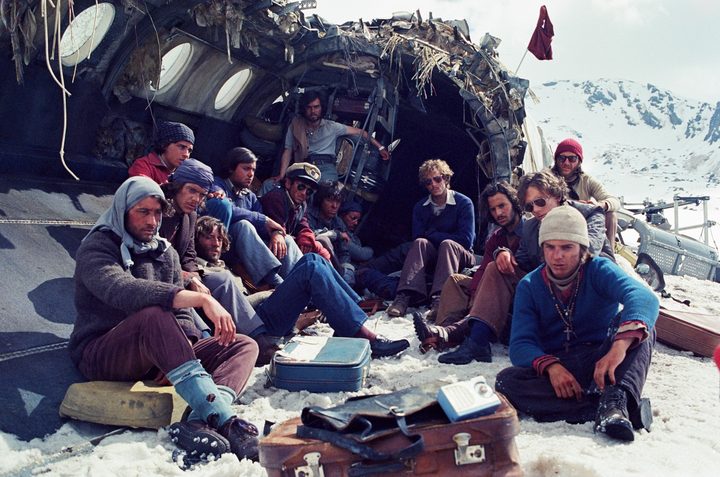 People gather at a crashed plane in Society of the Snow.