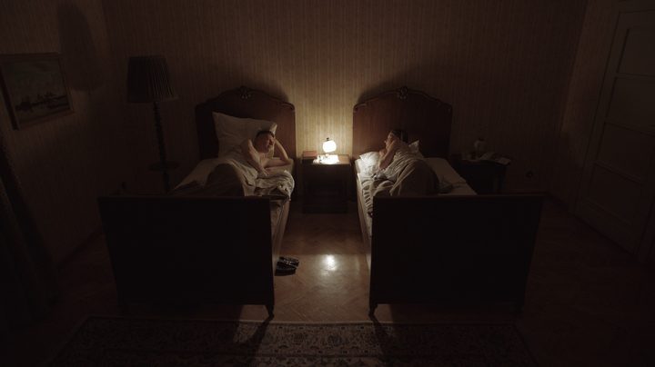 A couple sleep in separate beds in The Zone of Interest.