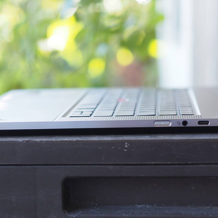 The side profile of the ThinkPad Z16 Gen 2 on a table outside.